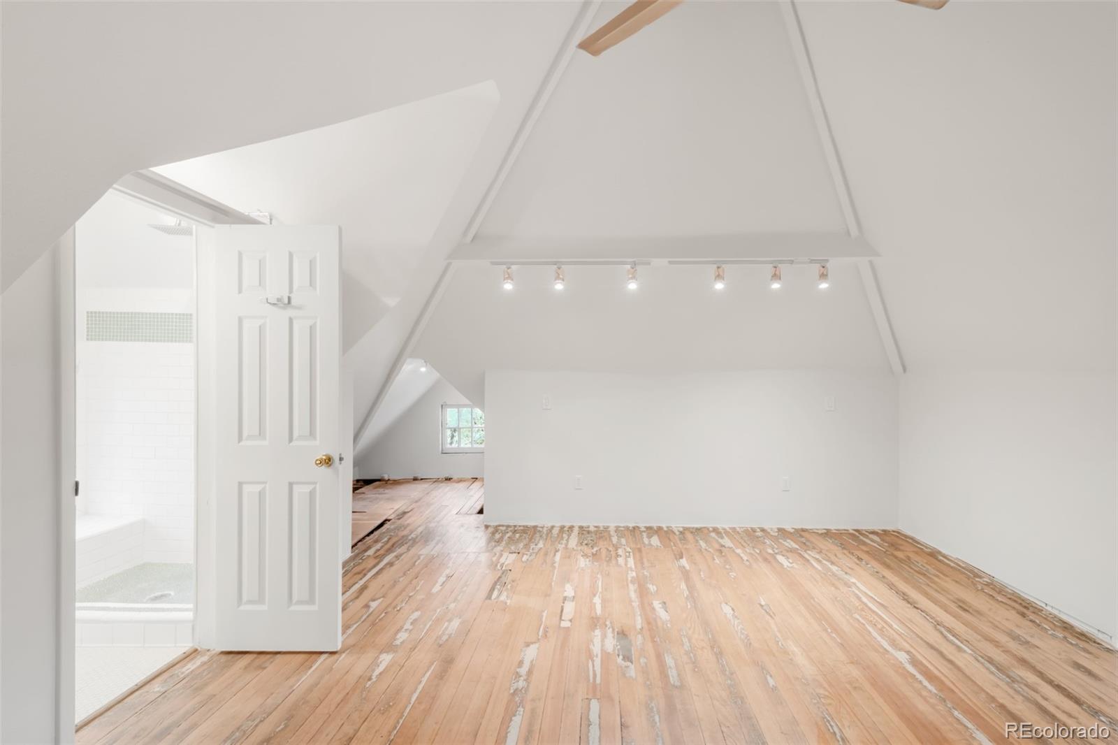 3905 Tejon Street Denver, CO 80211 - Photo 40 of 47 a view of empty room with wooden floor