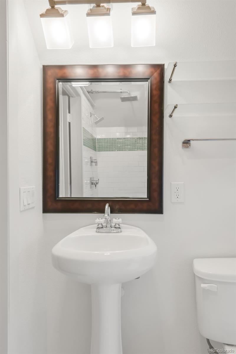 3905 Tejon Street Denver, CO 80211 - Photo 42 of 47 a bathroom with a sink and a mirror
