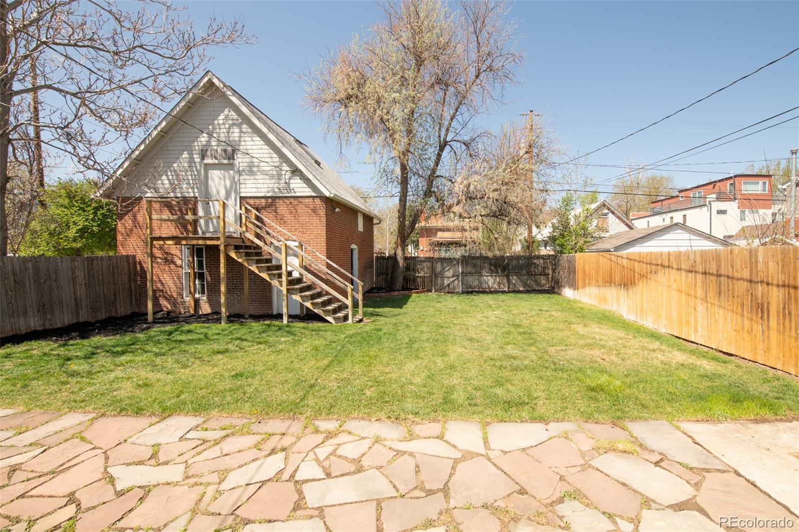 3905 Tejon Street Denver, CO 80211 - Photo 46 of 47 a view of a house with a yard