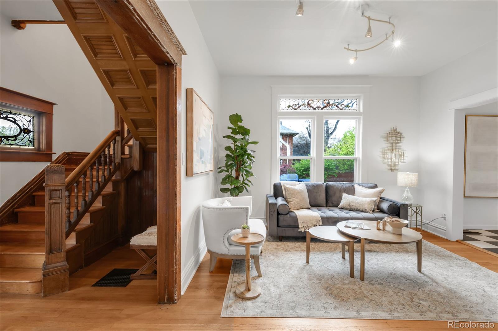 3905 Tejon Street Denver, CO 80211 - Photo 6 of 47 a living room with furniture and a potted plant