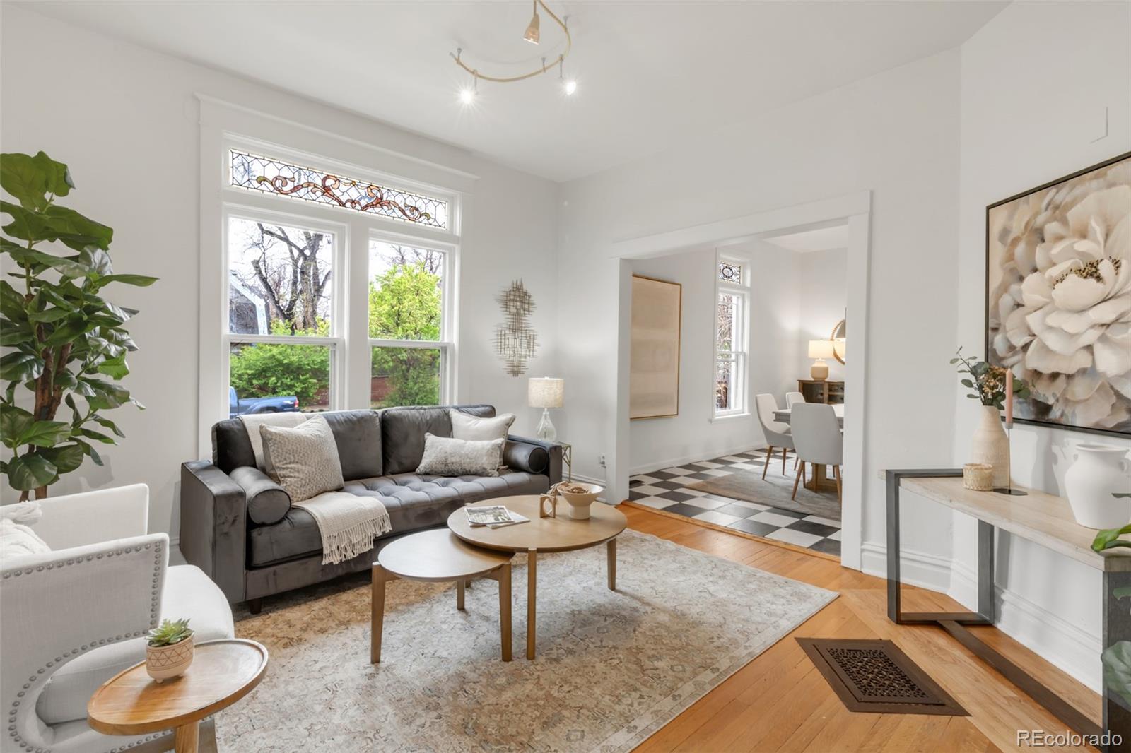 3905 Tejon Street Denver, CO 80211 - Photo 7 of 47 a living room with furniture and a large window