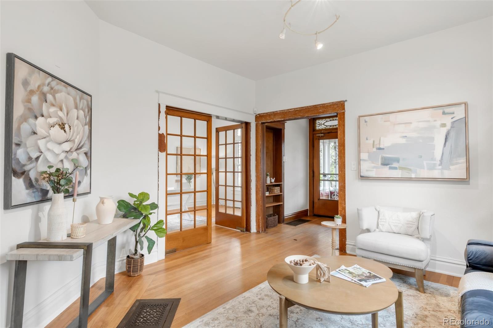3905 Tejon Street Denver, CO 80211 - Photo 9 of 47 a living room with furniture and a potted plant