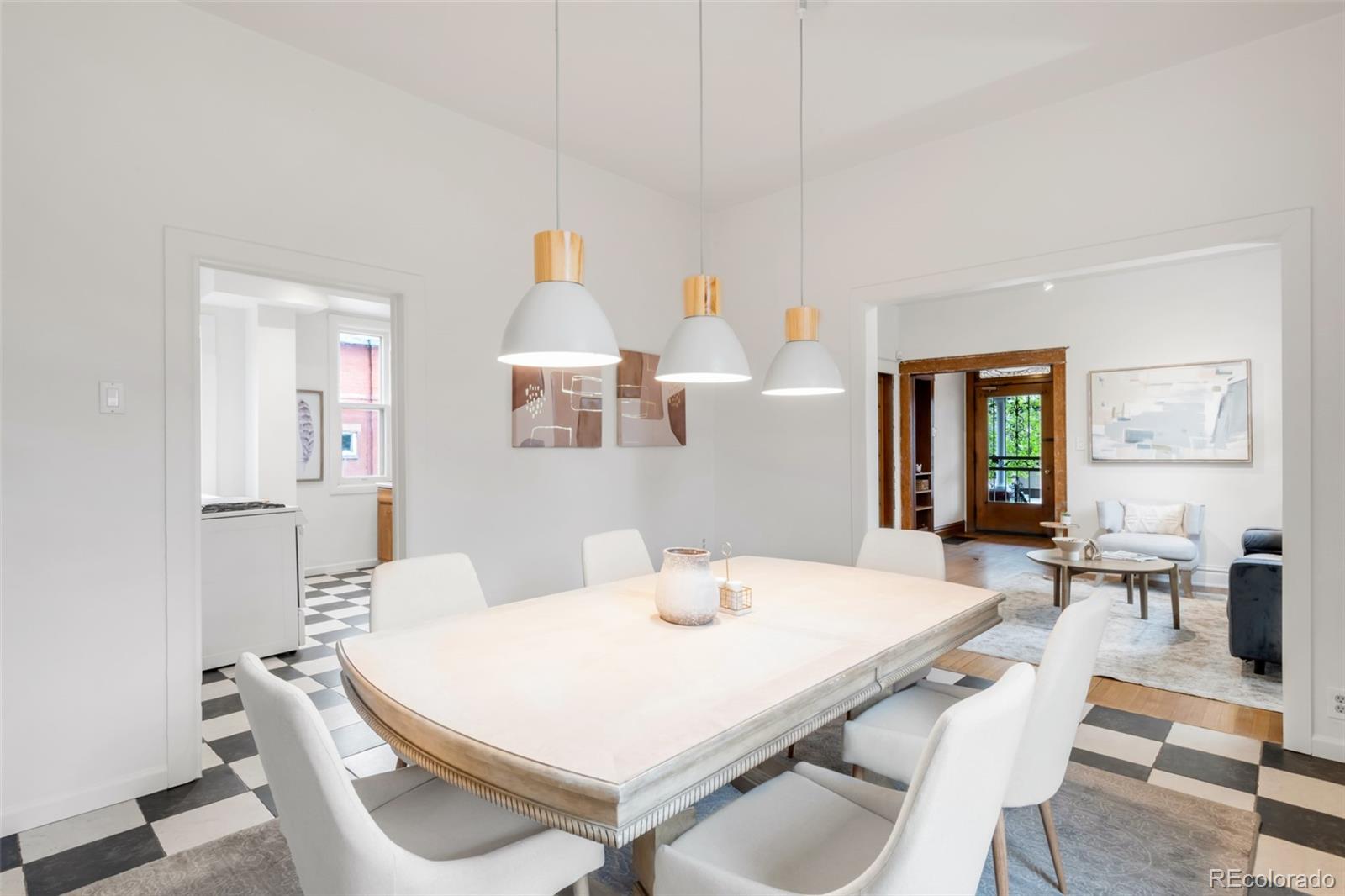 3905 Tejon Street Denver, CO 80211 - Photo 10 of 47 a view of a dining room with furniture and wooden floor