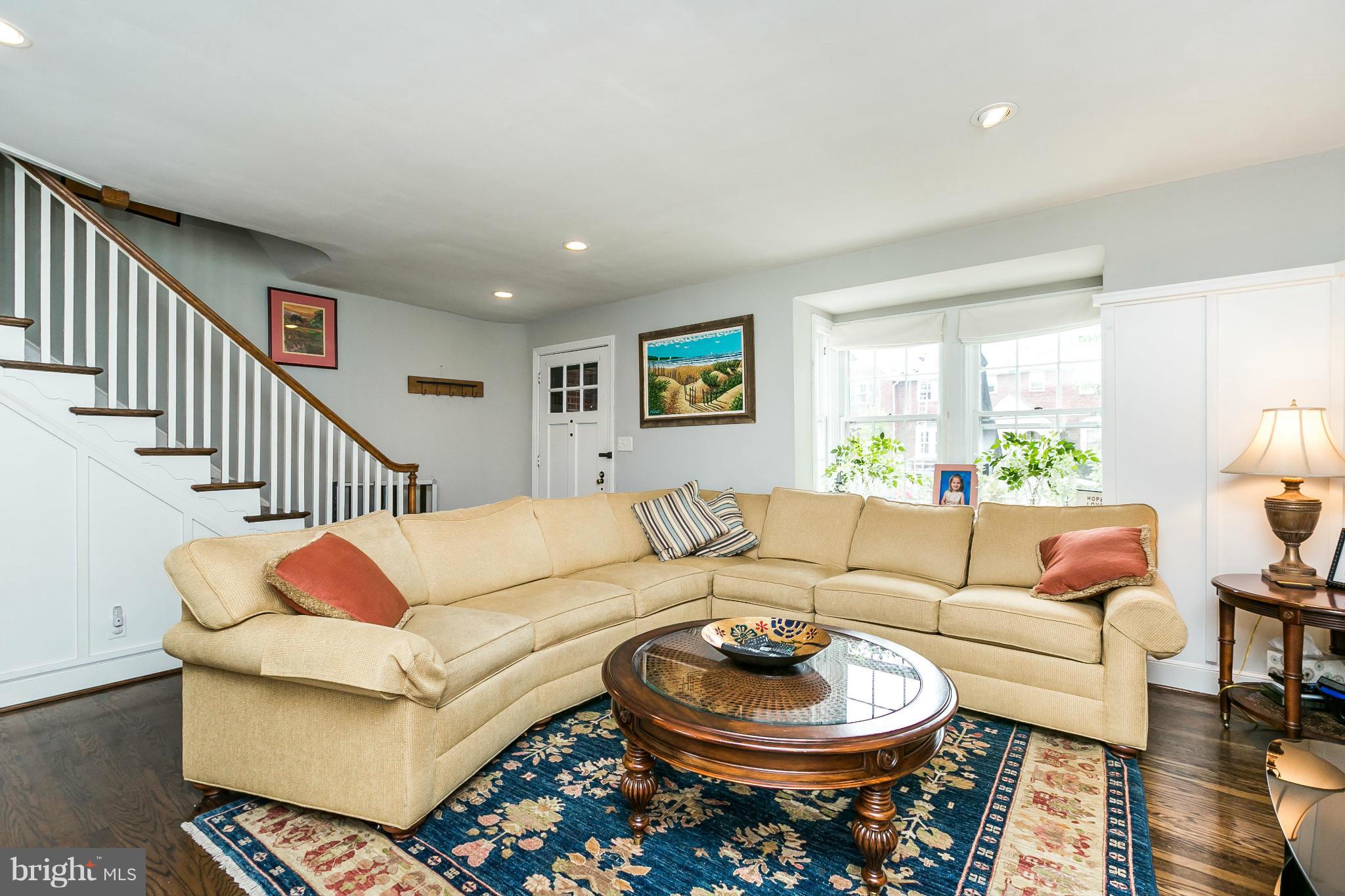 402 Murdock Road Baltimore, MD 21212 - Photo 3 of 24 a living room with furniture a rug and a lamp