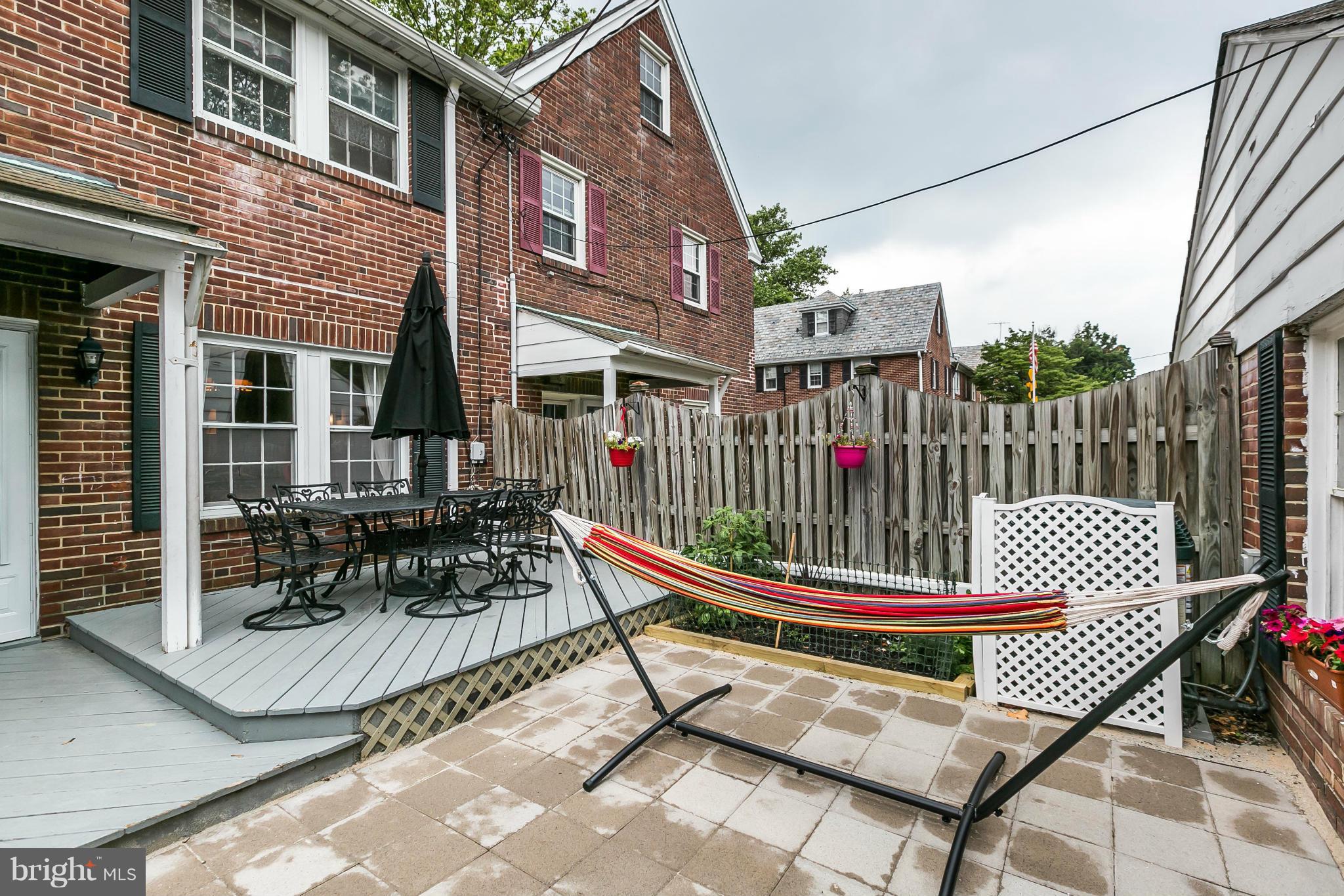 402 Murdock Road Baltimore, MD 21212 - Photo 22 of 24 a table and chair sitting in front of a house