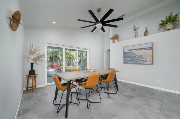 a view of a dining room with furniture and a window