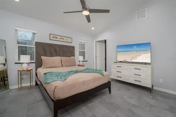 a bedroom with a bed and a dresser