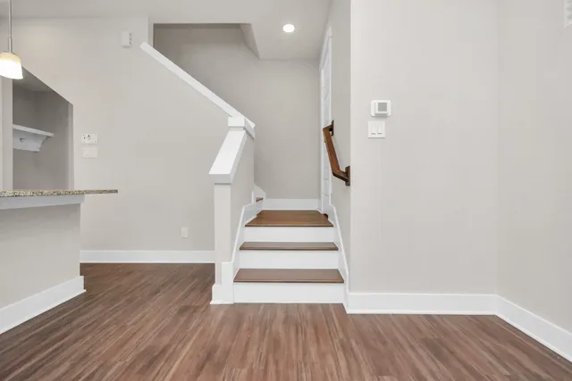 a view of entryway with wooden floor