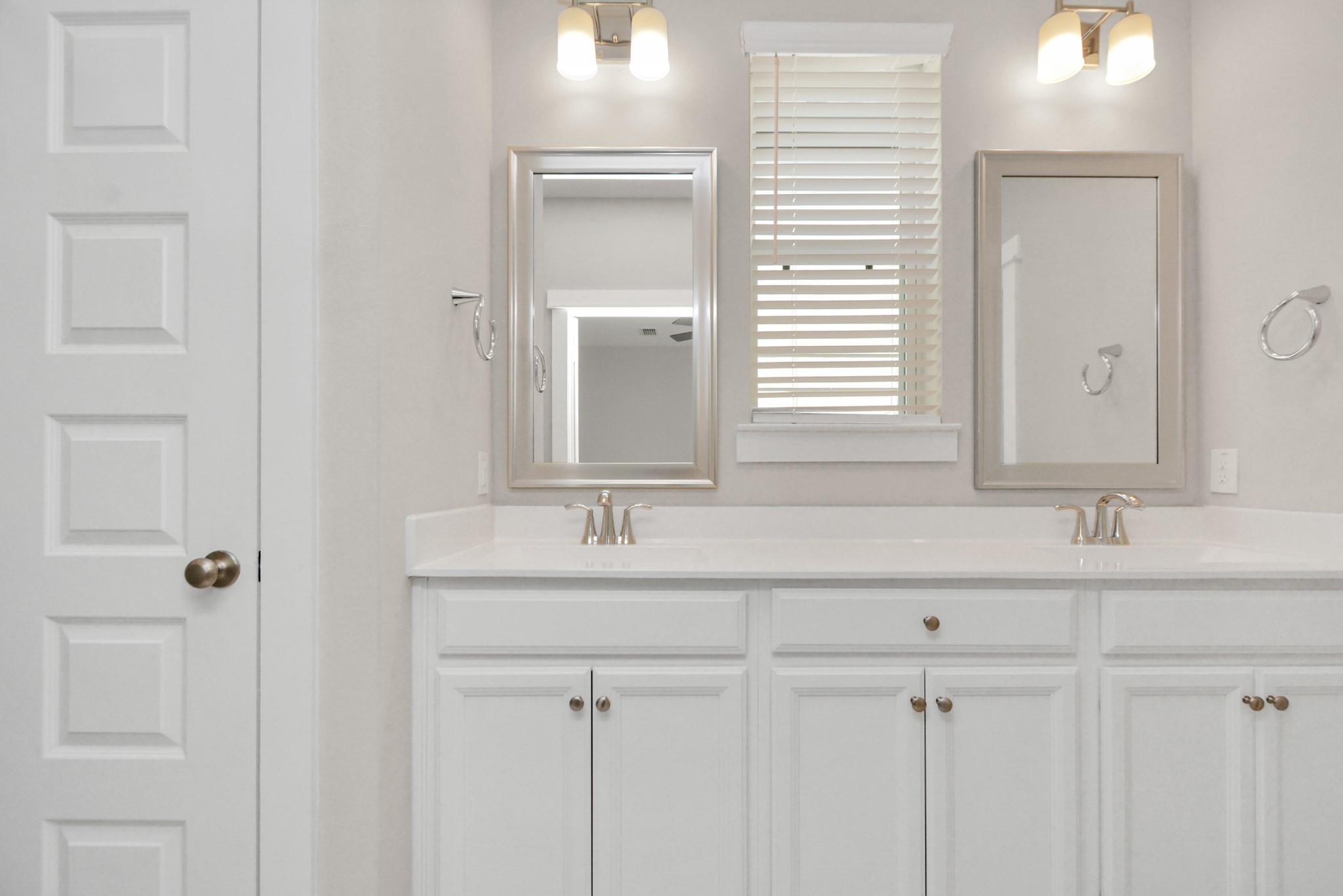 746 Strawberry Pines Court Houston, TX 77009 - Photo 29 of 50 a bathroom with double sink and a mirror