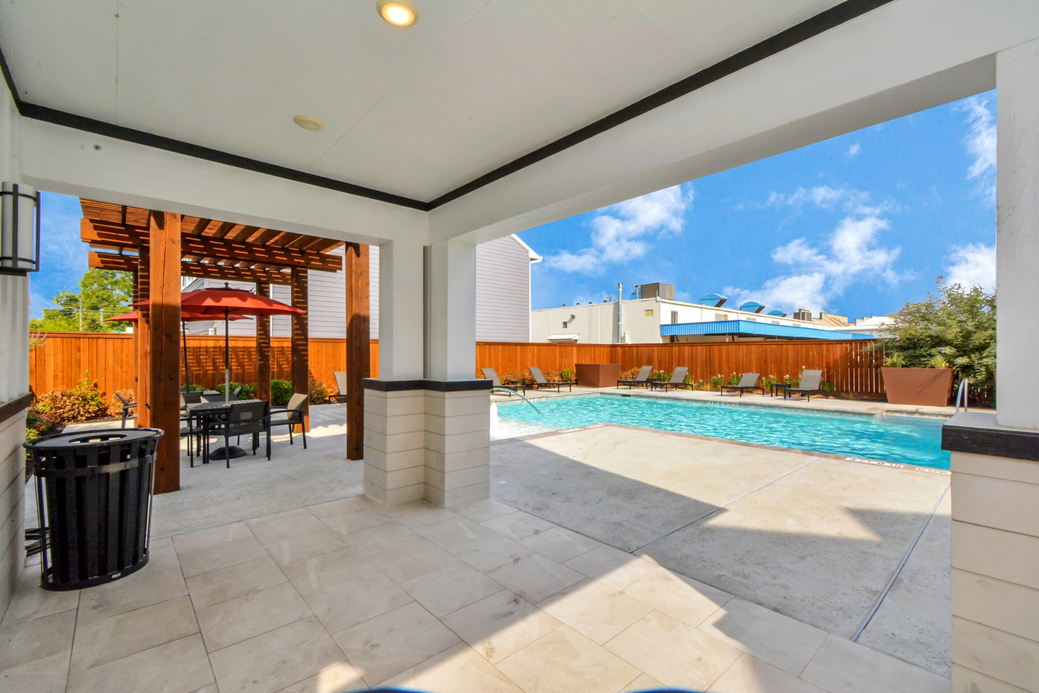 746 Strawberry Pines Court Houston, TX 77009 - Photo 46 of 50 a view of swimming pool with a table and chairs