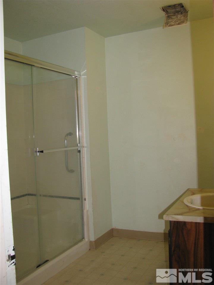 3399 Crystal Lane, Unit B1 Reno, NV 89512 - Photo 11 of 11 a bathroom with a shower