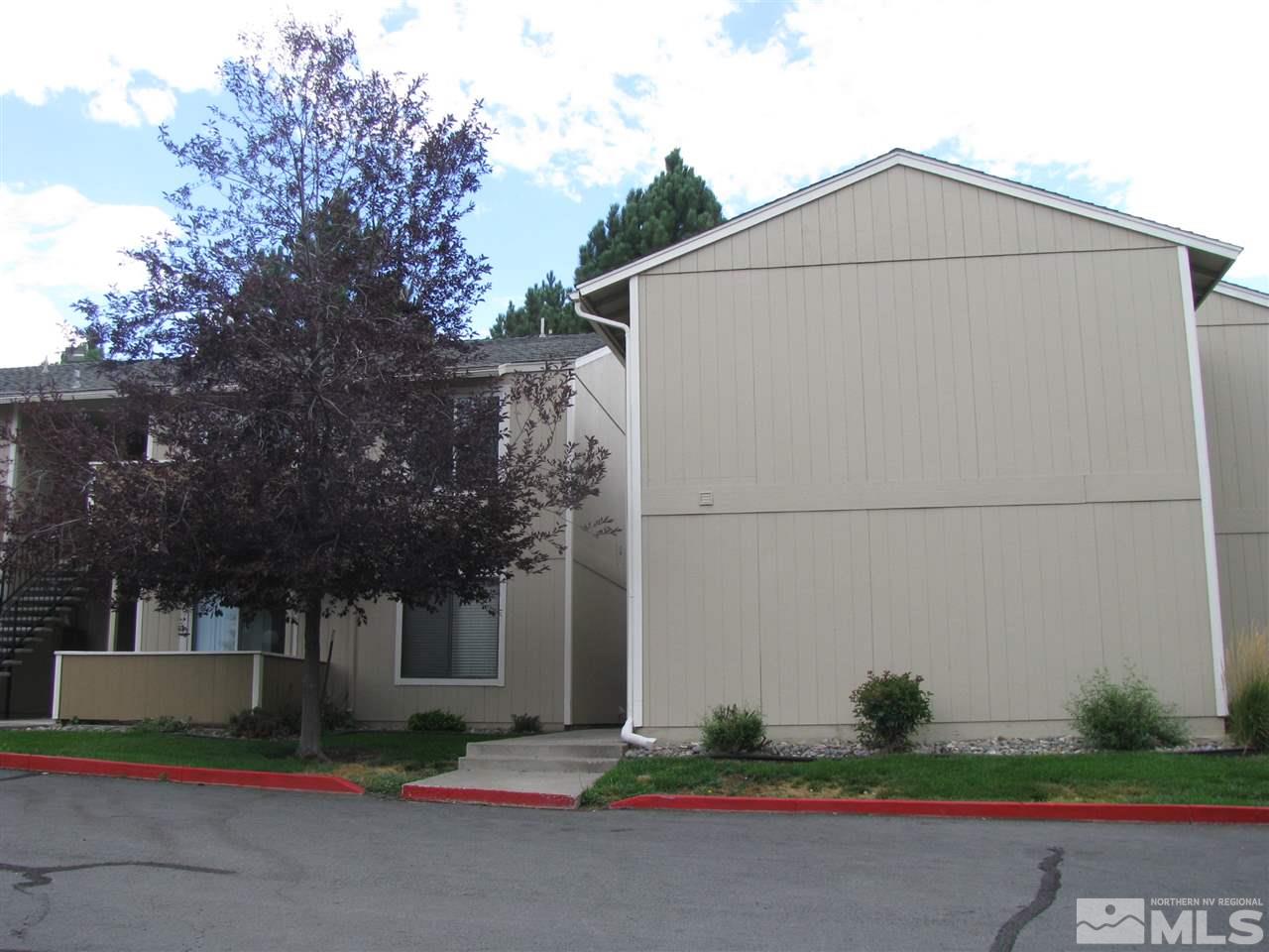 3399 Crystal Lane, Unit B1 Reno, NV 89512 - Photo 3 of 11 a white house with tree in the background