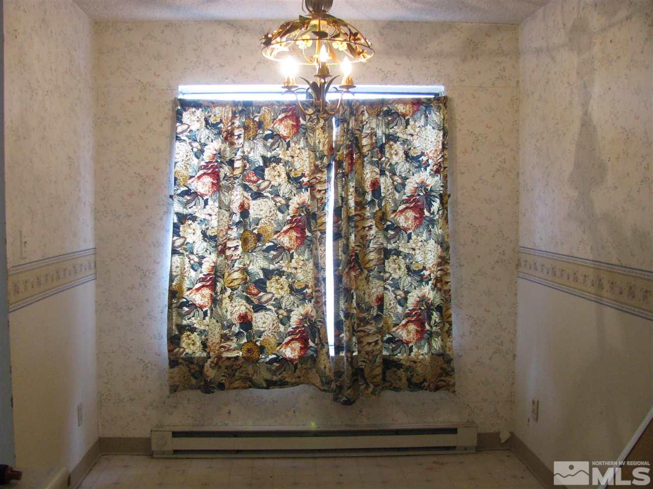 3399 Crystal Lane, Unit B1 Reno, NV 89512 - Photo 7 of 11 a view of a chandelier in a room