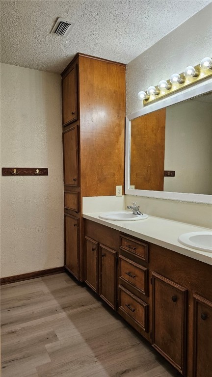 903 Summit Circle Portland, TX 78374 - Photo 17 of 23 a bathroom with a double vanity sink and a mirror