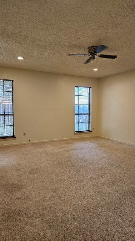 903 Summit Circle Portland, TX 78374 - Photo 18 of 23 an empty room with windows and ceiling fan view
