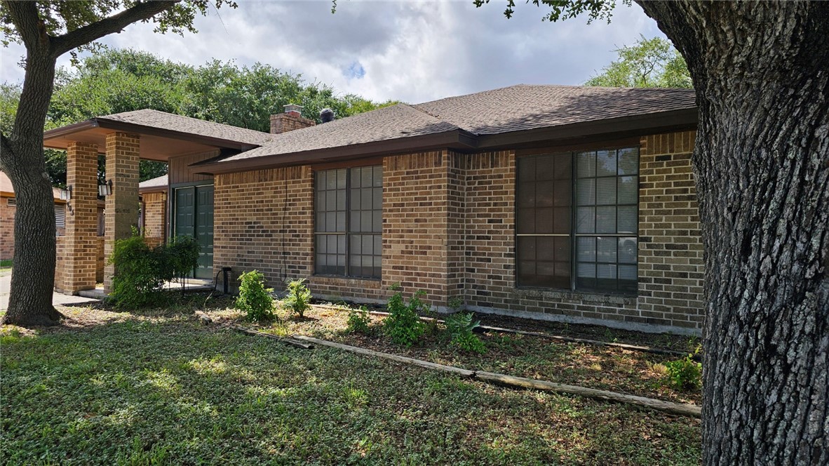 903 Summit Circle Portland, TX 78374 - Photo 5 of 23 a front view of a house with garden