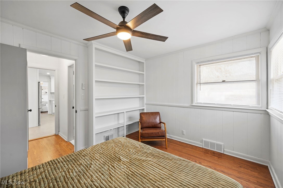 15857 Henley Road Cleveland, OH 44112 - Photo 12 of 42 Unfurnished bedroom featuring ceiling fan, crown molding, and light hardwood / wood-style floors