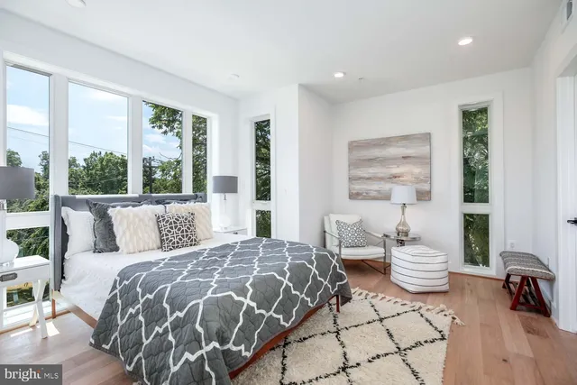 a bedroom with a large bed and a window