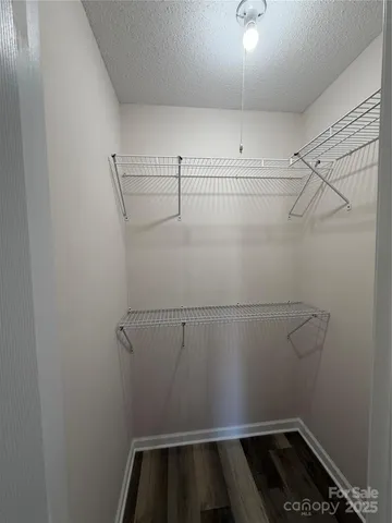 a view of storage and utility room with racks on the wall