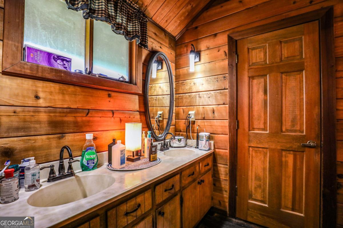 75 Deerfield Road Covington, GA 30014 - Photo 18 of 44 a bathroom with sink and mirror