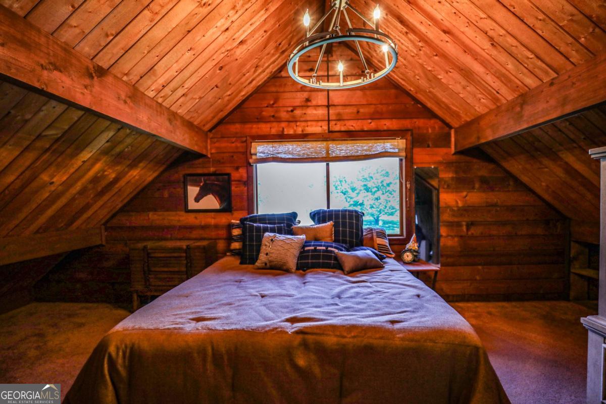 75 Deerfield Road Covington, GA 30014 - Photo 21 of 44 a bedroom with a bed and a night stand