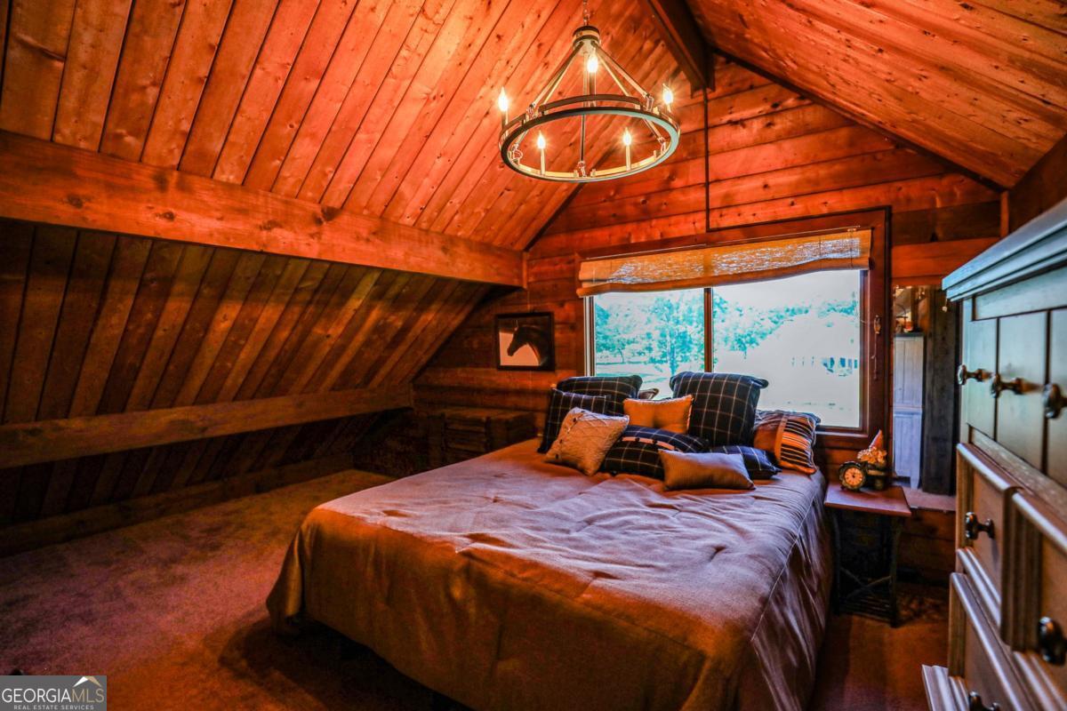 75 Deerfield Road Covington, GA 30014 - Photo 22 of 44 a bed sitting in a bedroom next to a window