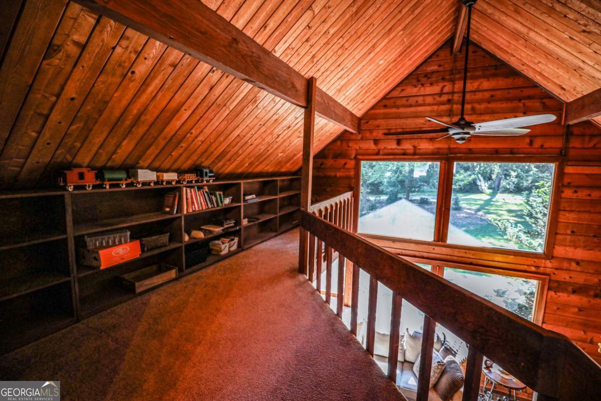 75 Deerfield Road Covington, GA 30014 - Photo 23 of 44 a view of an empty room with wooden floor and windows
