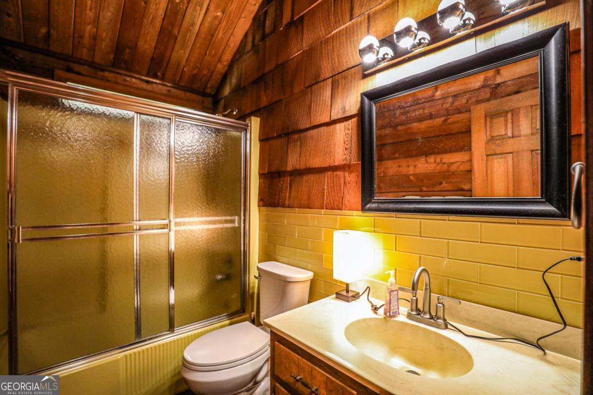 75 Deerfield Road Covington, GA 30014 - Photo 27 of 44 a bathroom with a sink toilet and shower