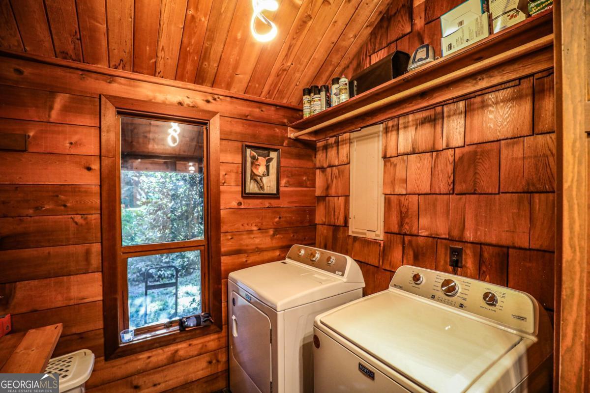 75 Deerfield Road Covington, GA 30014 - Photo 32 of 44 a utility room with dryer and washer