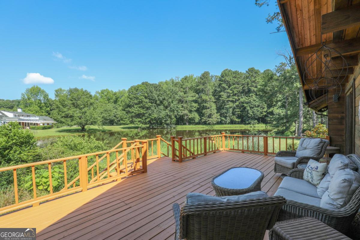 75 Deerfield Road Covington, GA 30014 - Photo 33 of 44 a view of a balcony with lake view and a potted plant