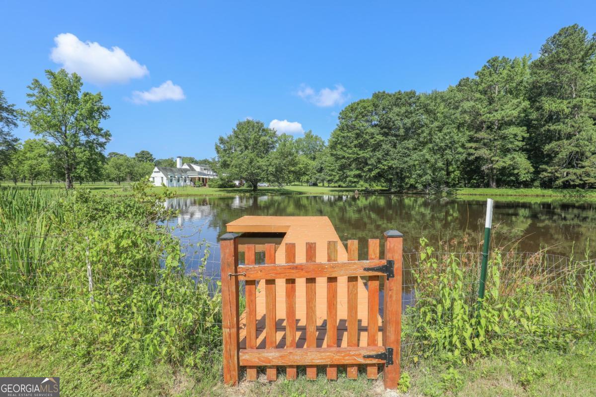 75 Deerfield Road Covington, GA 30014 - Photo 37 of 44 a view of a brick wall with a lake view