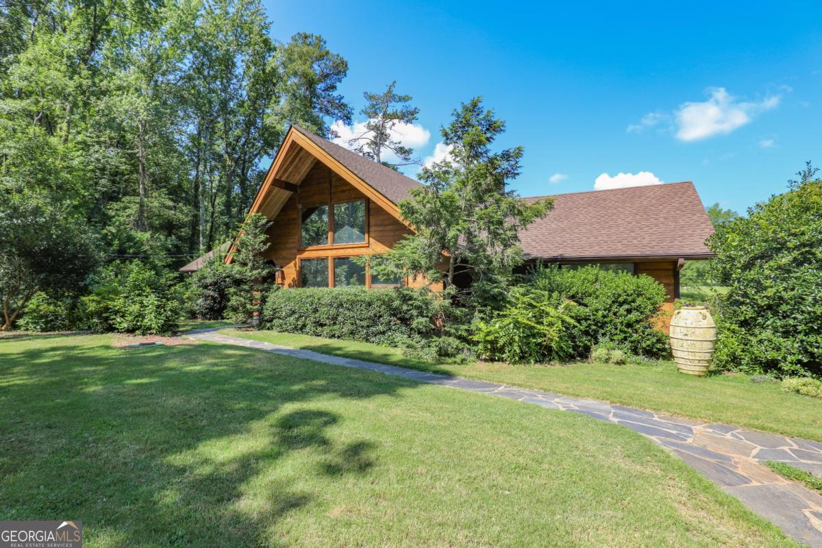 75 Deerfield Road Covington, GA 30014 - Photo 40 of 44 a house view with a garden space