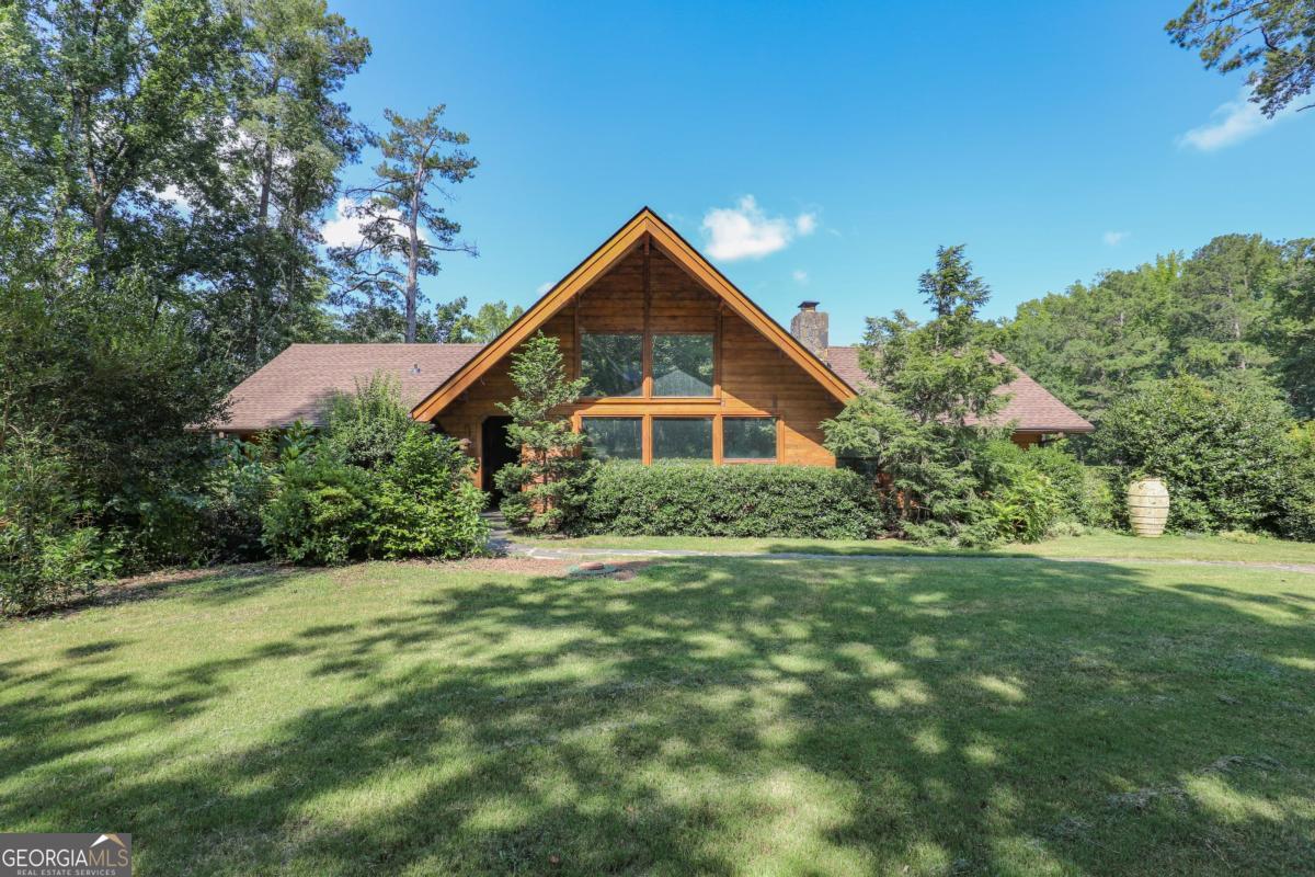 75 Deerfield Road Covington, GA 30014 - Photo 41 of 44 a front view of house with yard and green space