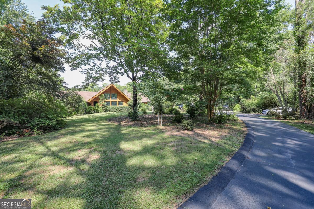 75 Deerfield Road Covington, GA 30014 - Photo 43 of 44 a view of a park with large trees