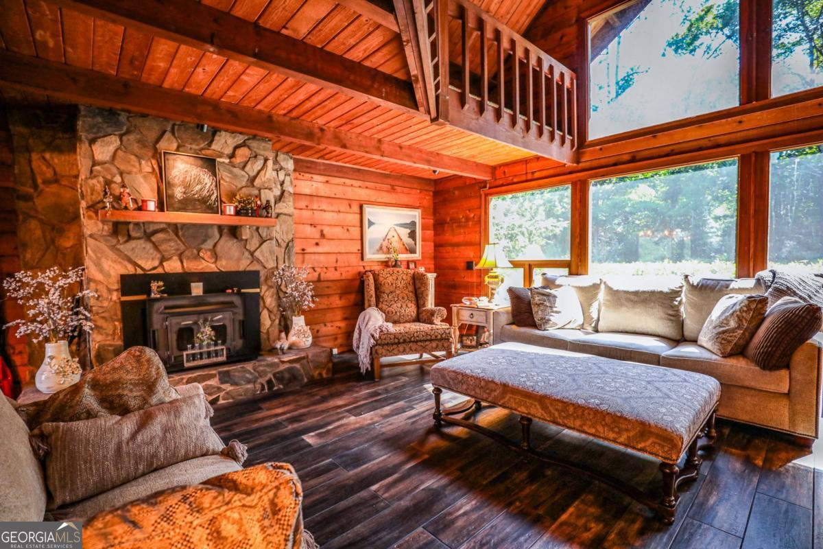 75 Deerfield Road Covington, GA 30014 - Photo 6 of 44 a living room with furniture a fireplace and city view