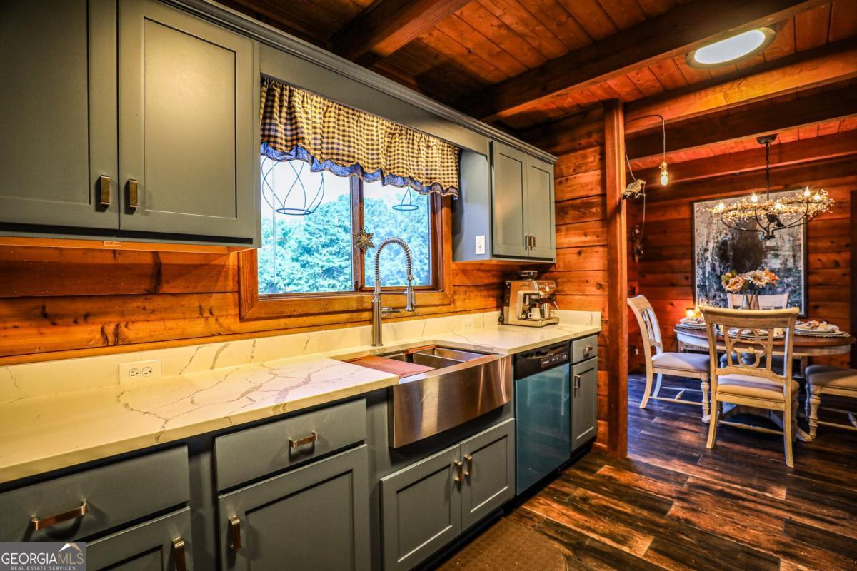 75 Deerfield Road Covington, GA 30014 - Photo 10 of 44 a view of a kitchen with a sink and wooden cabinets