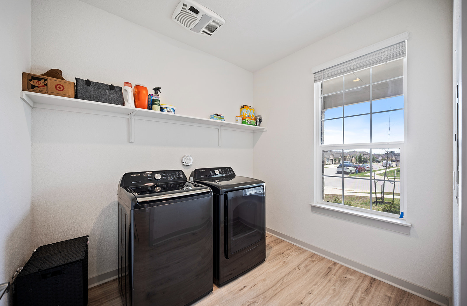 900 Balsora Cove Georgetown, TX 78628 - Photo 19 of 39 A well-lit laundry area boasts ample shelving and a large window overlooking the neighborhood.