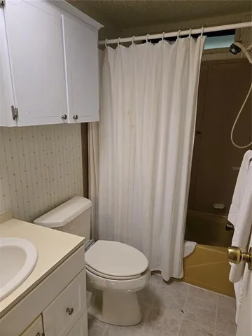 a view of a hallway with closet and wooden floor