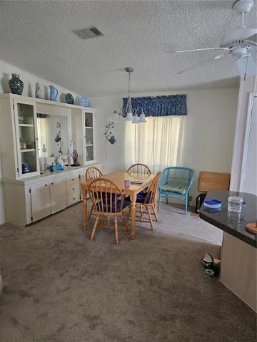 a bed room with a bed and a chair