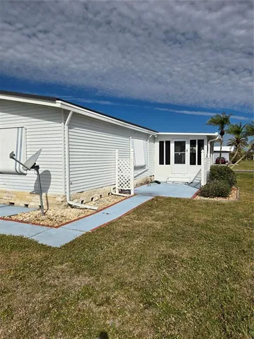 a house view with a backyard space