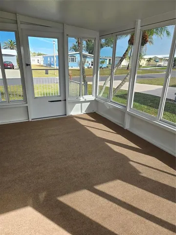 a view of an empty room with a fireplace