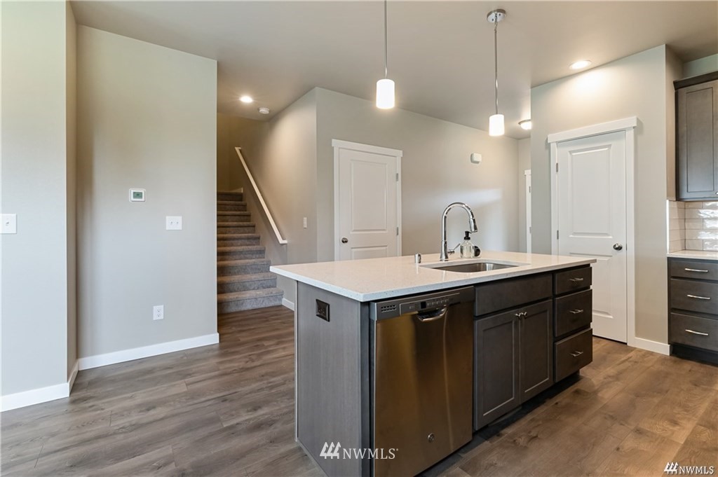 6902 Red Ridge Drive, Unit B Lynden, WA 98264 - Photo 9 of 33 a kitchen with a sink and wooden floor