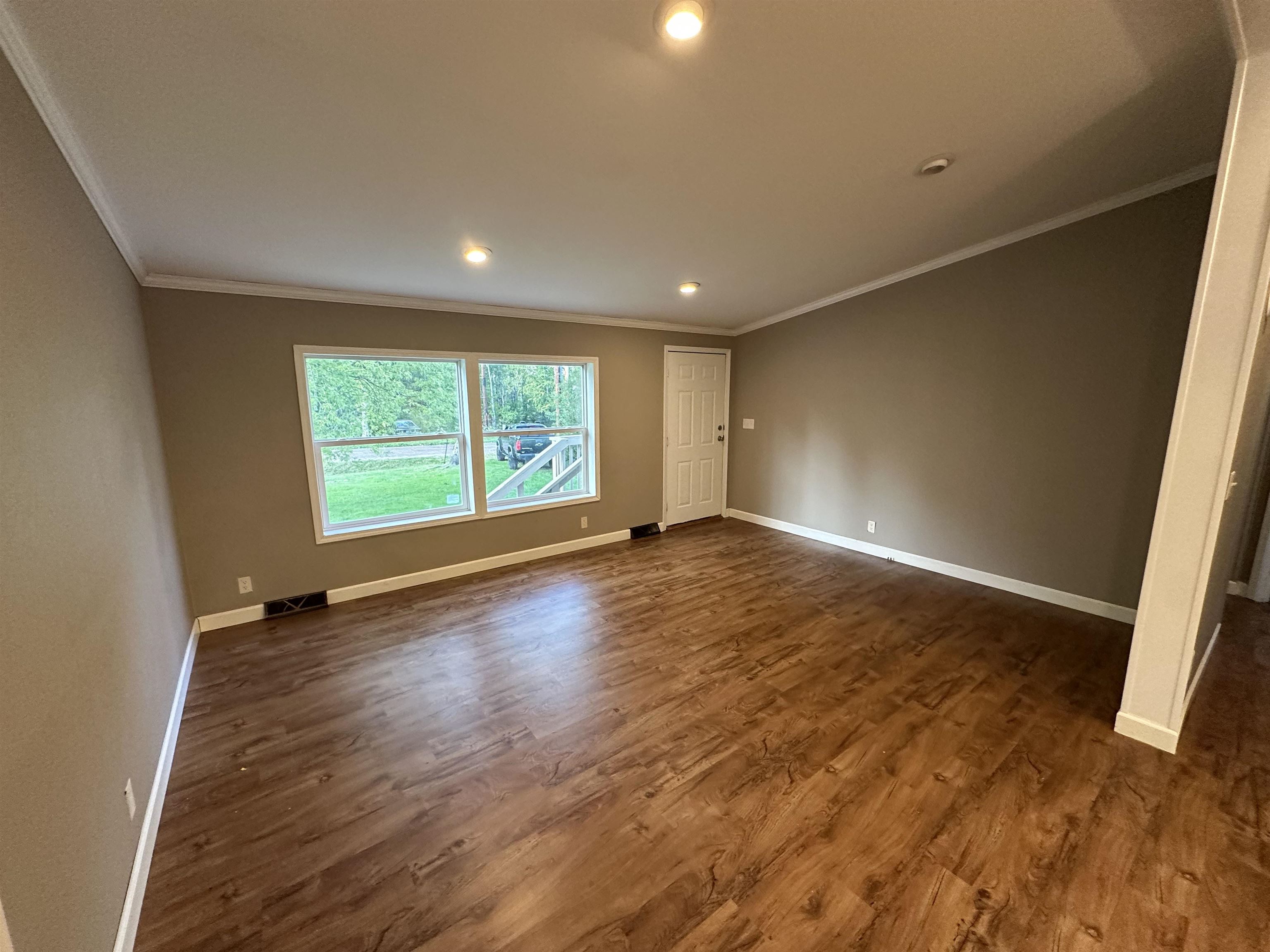 3748 Mulvahill Road Rice Lake, MN 55803 - Photo 11 of 26 Featuring dark wood finished floors, crown molding, and recessed lighting.