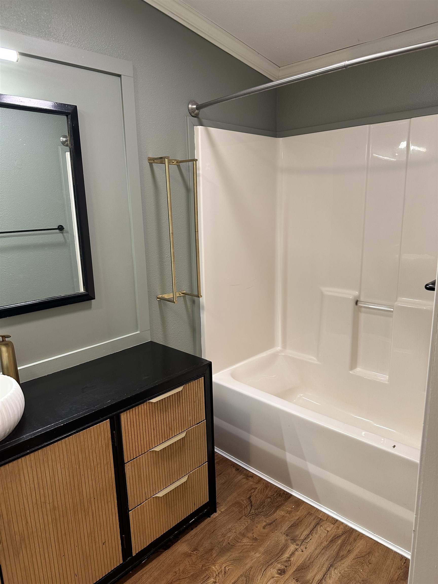3748 Mulvahill Road Rice Lake, MN 55803 - Photo 14 of 26 Master Bathroom featuring shower / washtub combination, dark wood finished floors, and ornamental molding