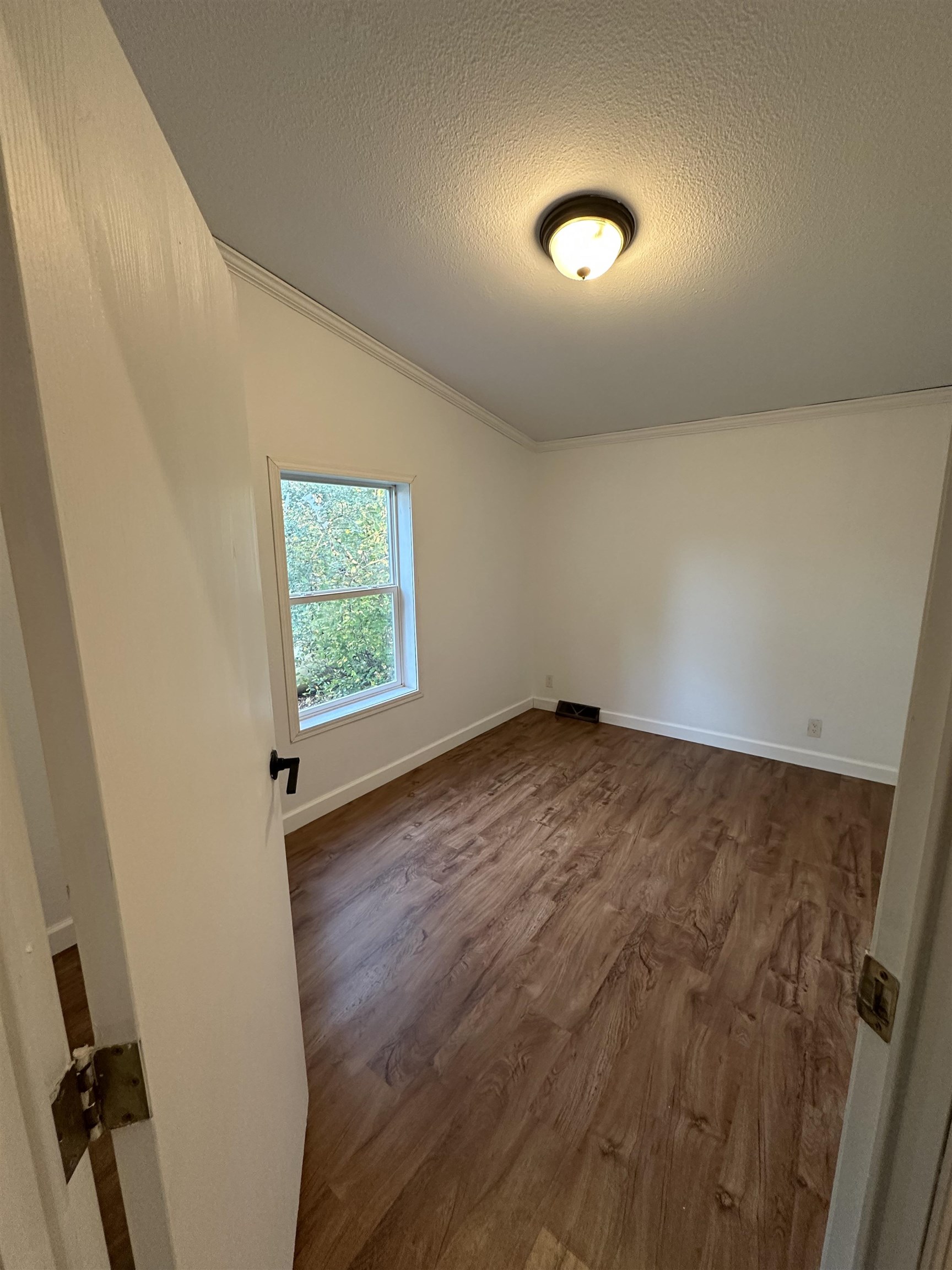 3748 Mulvahill Road Rice Lake, MN 55803 - Photo 18 of 26 featuring dark wood-style flooring, a textured ceiling, and lofted ceiling