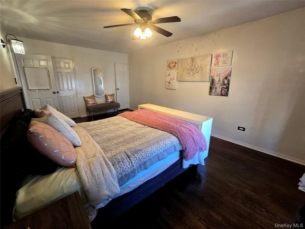 a bedroom with bed and window
