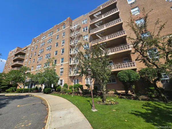 a view of a street with a building in the background