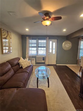 a living room with couches and painted walls