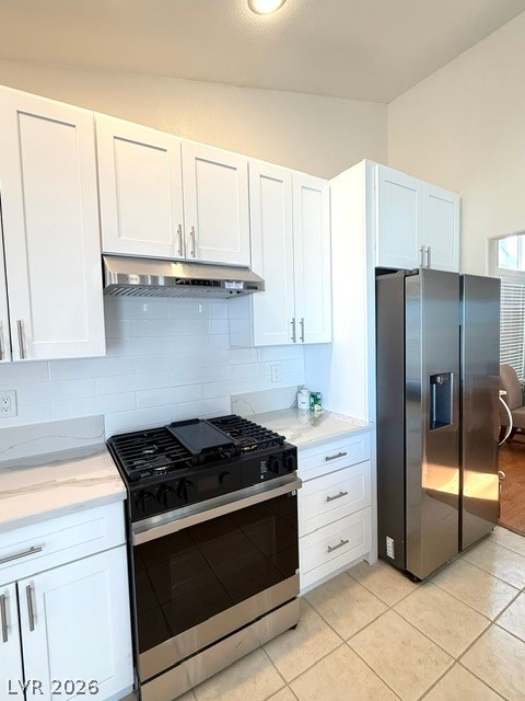 804 Rancho Coast Way Henderson, NV 89002 - Photo 19 of 20 High ceilings rise above shaker cabinetry, quartz countertops, and stainless appliances.