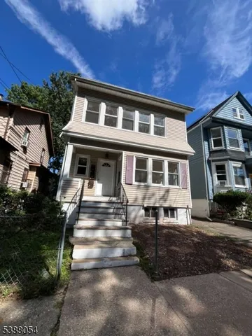 a front view of a house with a porch